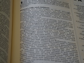 The page from a religious text, likely a Bible, includes paragraphs discussing Hosea's wife and children with detailed passages of biblical narrative. The text is formatted in two columns with a heading at the top.