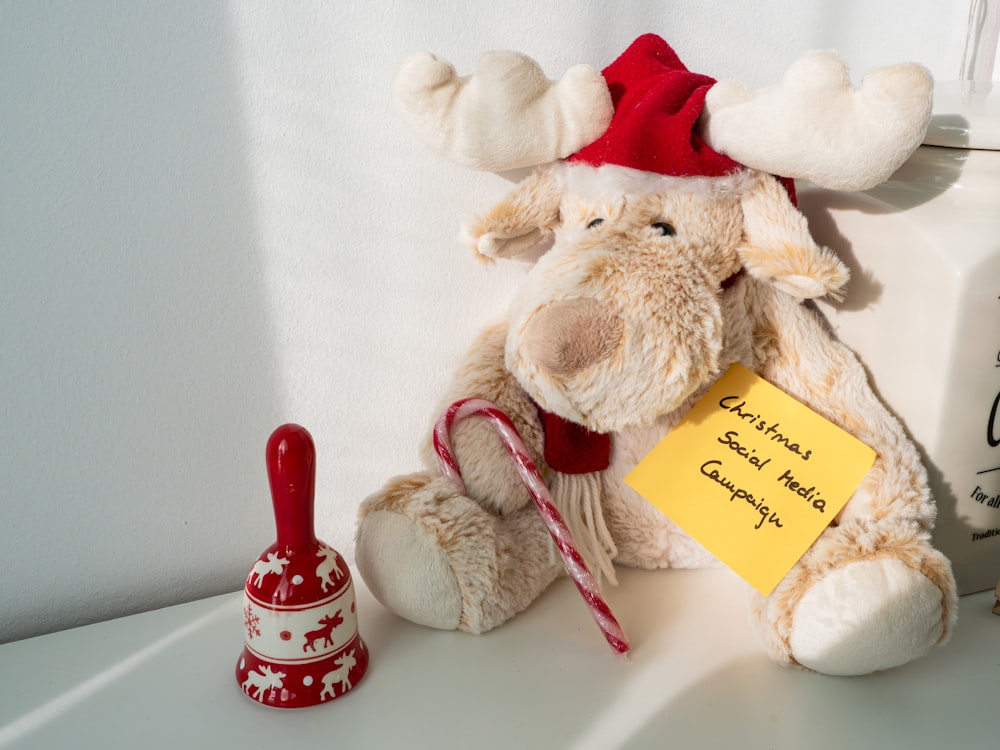 a stuffed animal with a note attached to it