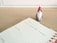 A planner opened to a page for Monday, the 9th, with a note reading 'Christmas Social Media Campaign.' A small decorative Santa figure is positioned on a wooden desk surface beside the planner.
