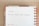 A calendar page for Monday, the 9th, featuring handwritten text that says 'Christmas Social Media Campaign.' The calendar is spiral-bound with orange rings, and the page has multilingual day headers.