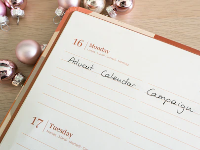 A calendar marked with a future date and a reminder note saying 'Launch Day'.