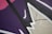 Abstract street art featuring bold, angular shapes and overlapping lines. The composition consists of dark purple, pink, and beige backgrounds, accentuated by black and white lines.