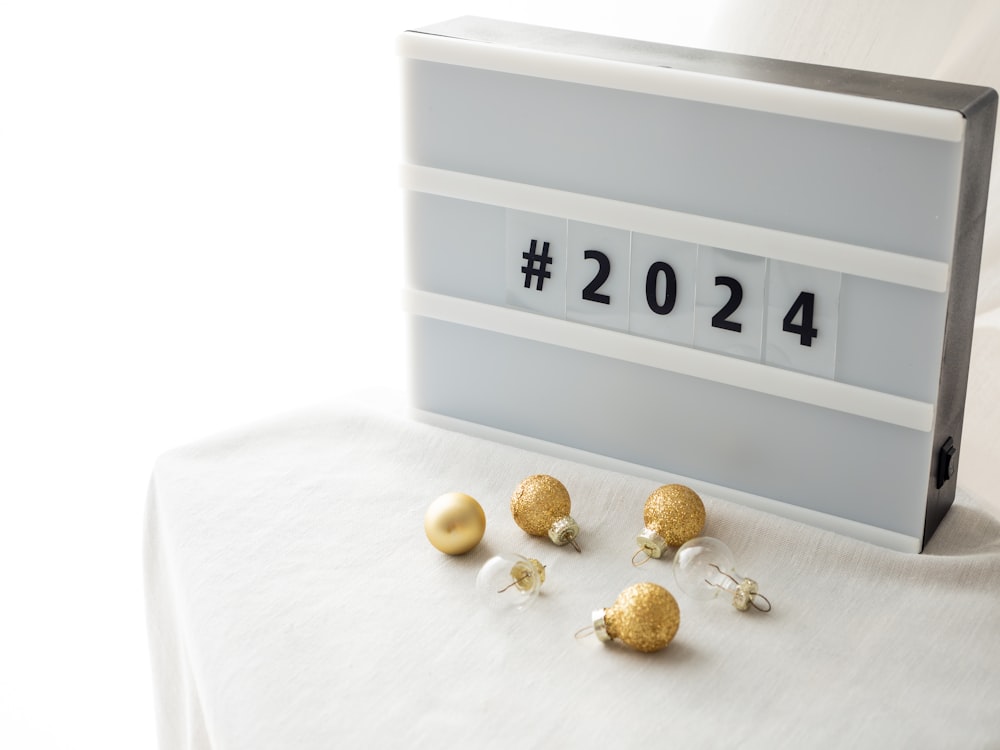 a table topped with gold and silver balls