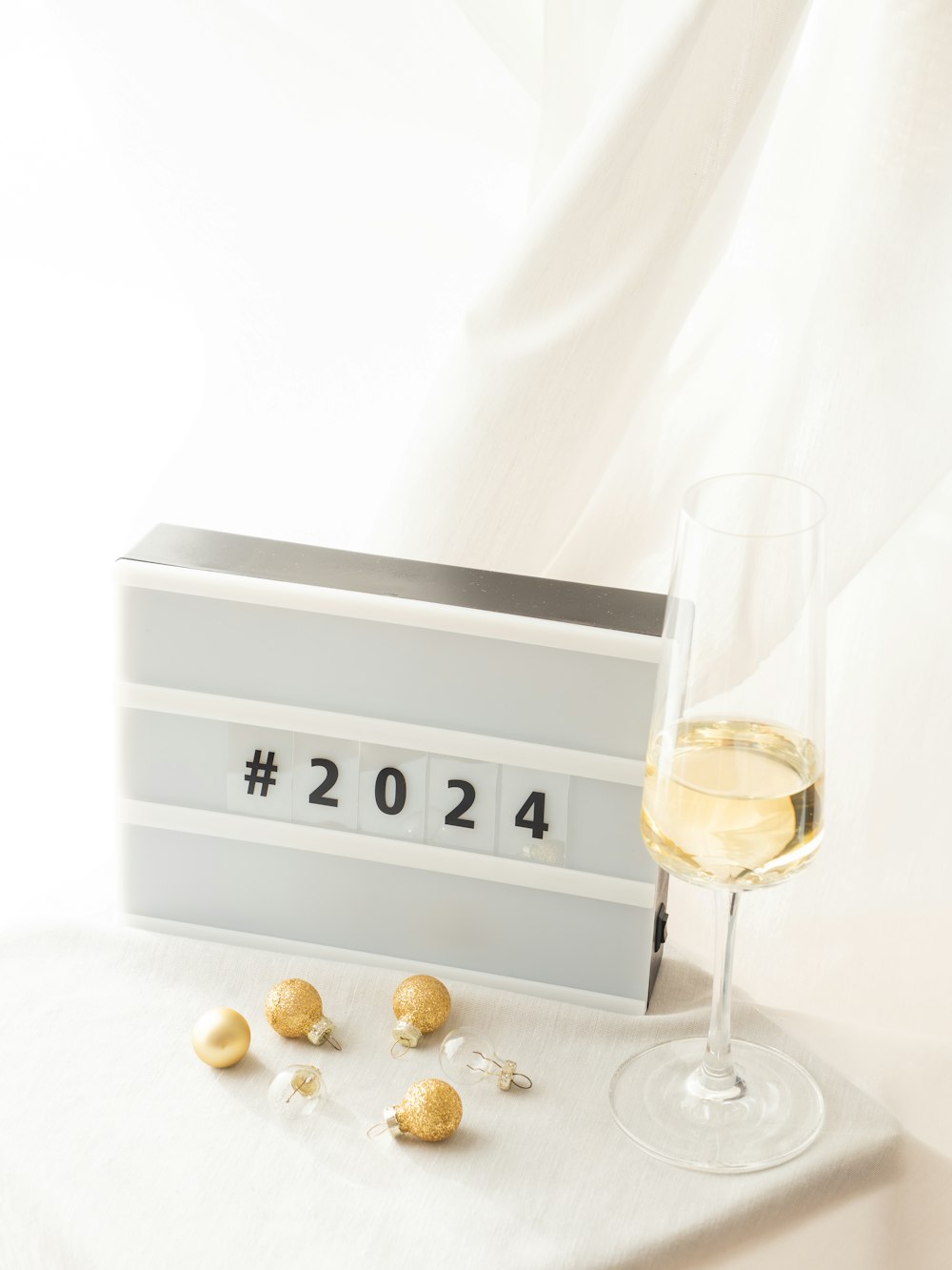 a glass of wine next to a calendar