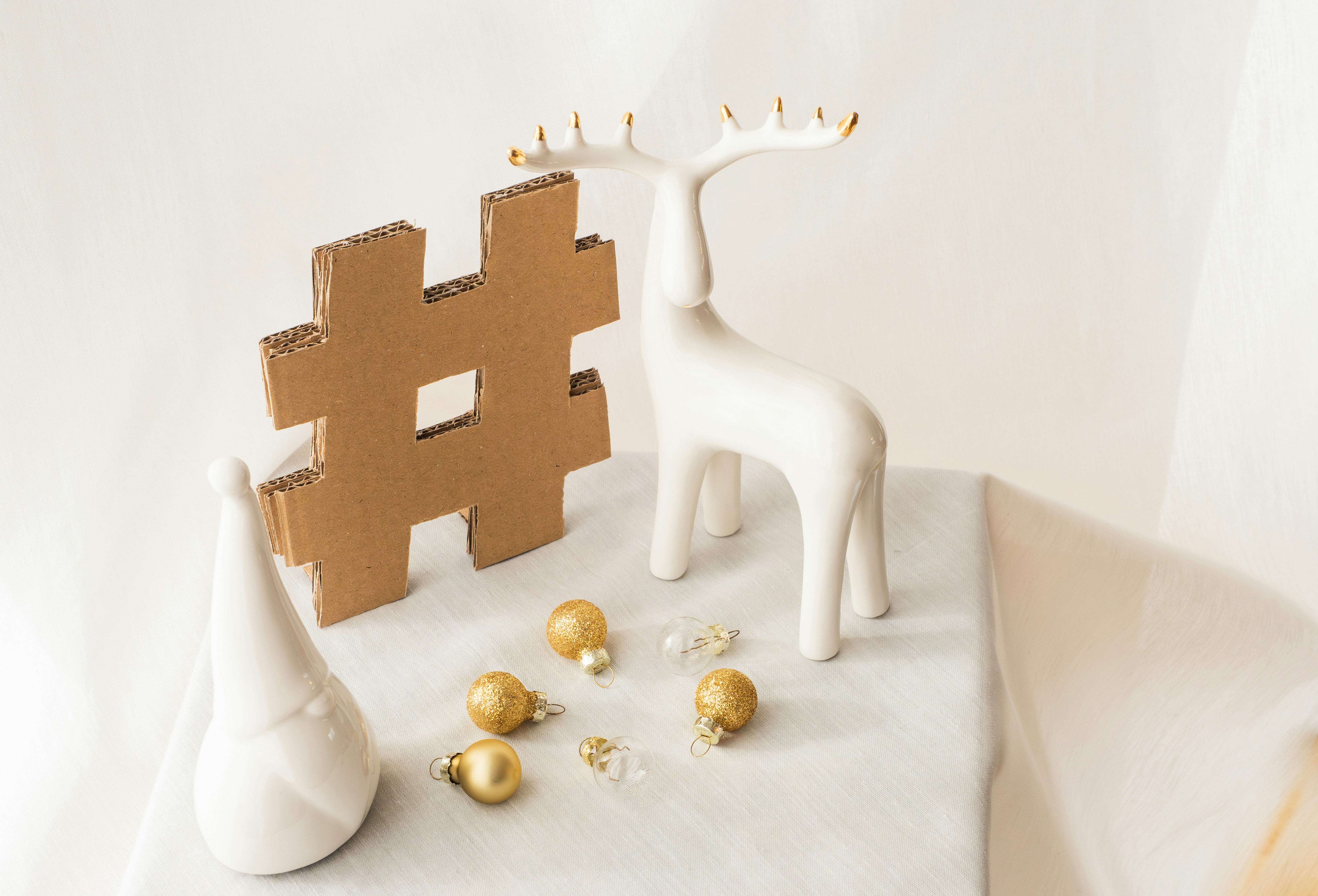 a giraffe made out of cardboard sitting on top of a table