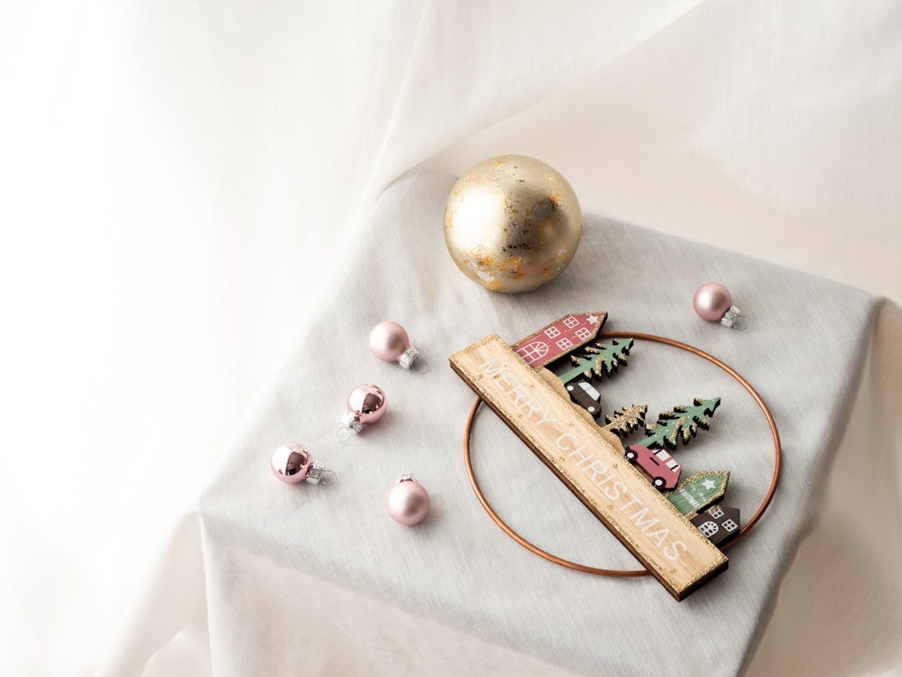 a table topped with a plate covered in christmas decorations