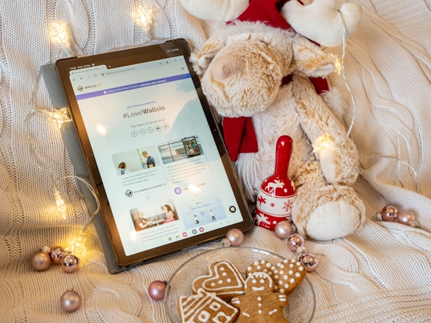 A cozy home setting with a tablet displaying wonderjoy studio's digital storybook.