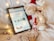 A cozy home setup with a person browsing an online store on a tablet.