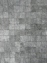 Smooth limestone tiles arranged in a neat pattern.