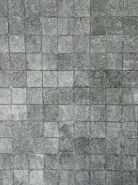 Finished stone tiles arranged in a decorative pattern.