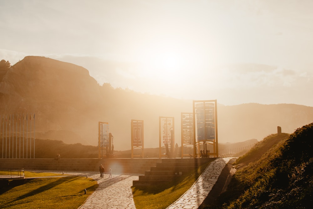 a person walking down a path in a park