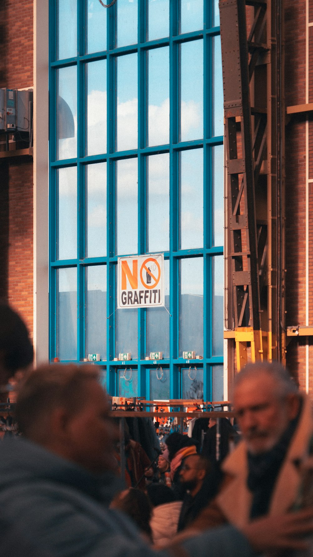 a group of people sitting outside of a building