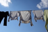 Casual shorts hanging on a clothesline under the sun.