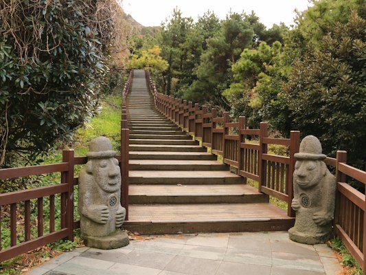 A set of steps with statues on each of them — Jeju, South Korea
