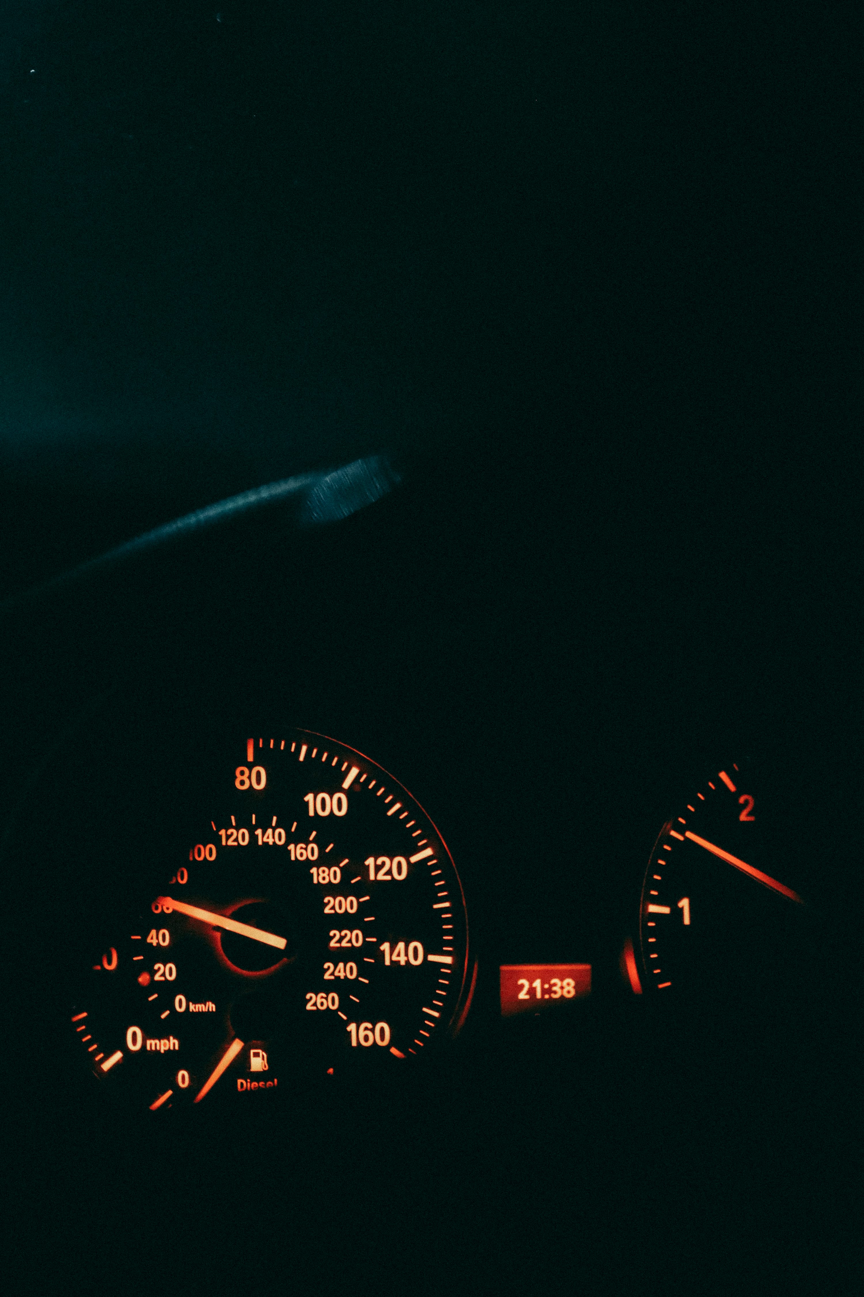the dashboard of a car at night time