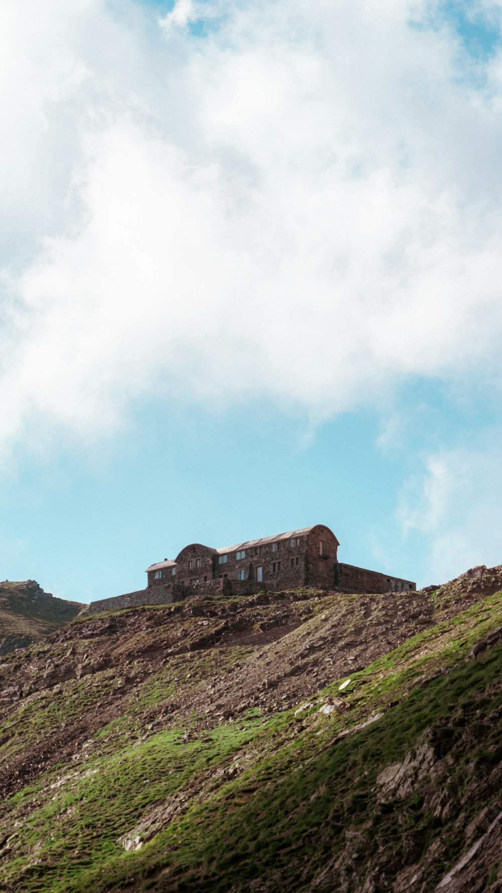 a hill with a house on top of it