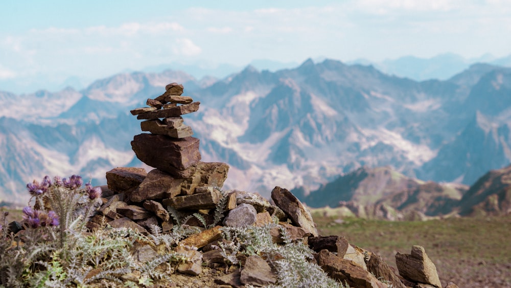 a pile of rocks sitting on top of a mountain