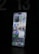 A modern smartphone is displayed with a lit-up screen showing various app icons, including weather, calendar, and social media applications, against a dark background. The screen's brightness highlights the device's sleek design.