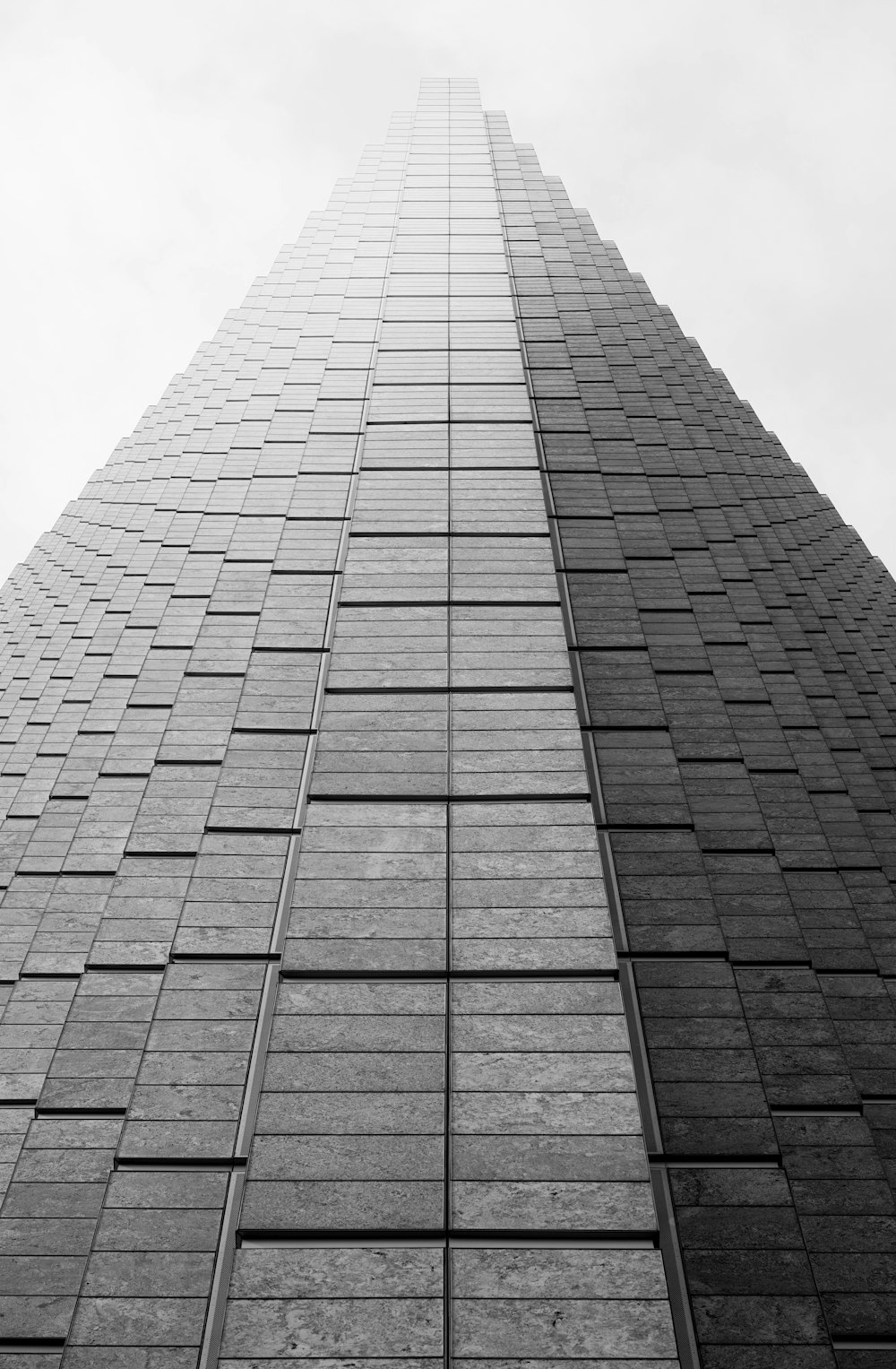 a black and white photo of a tall building