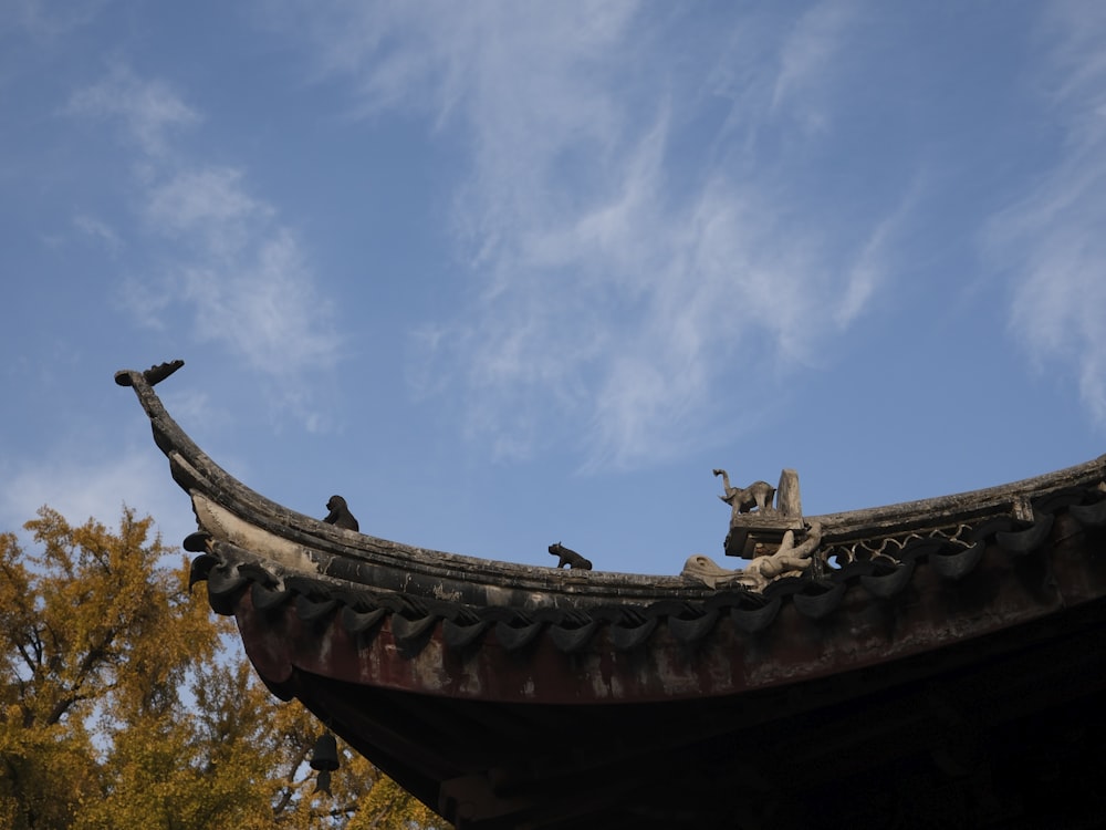 a roof with birds perched on top of it