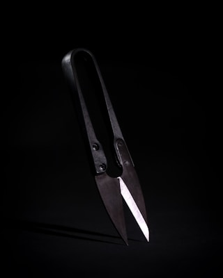 Close-up of a precision paper cutter with sharp blades.