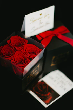 A beautifully wrapped personalized gift box with a custom name tag and delicate floral accents.