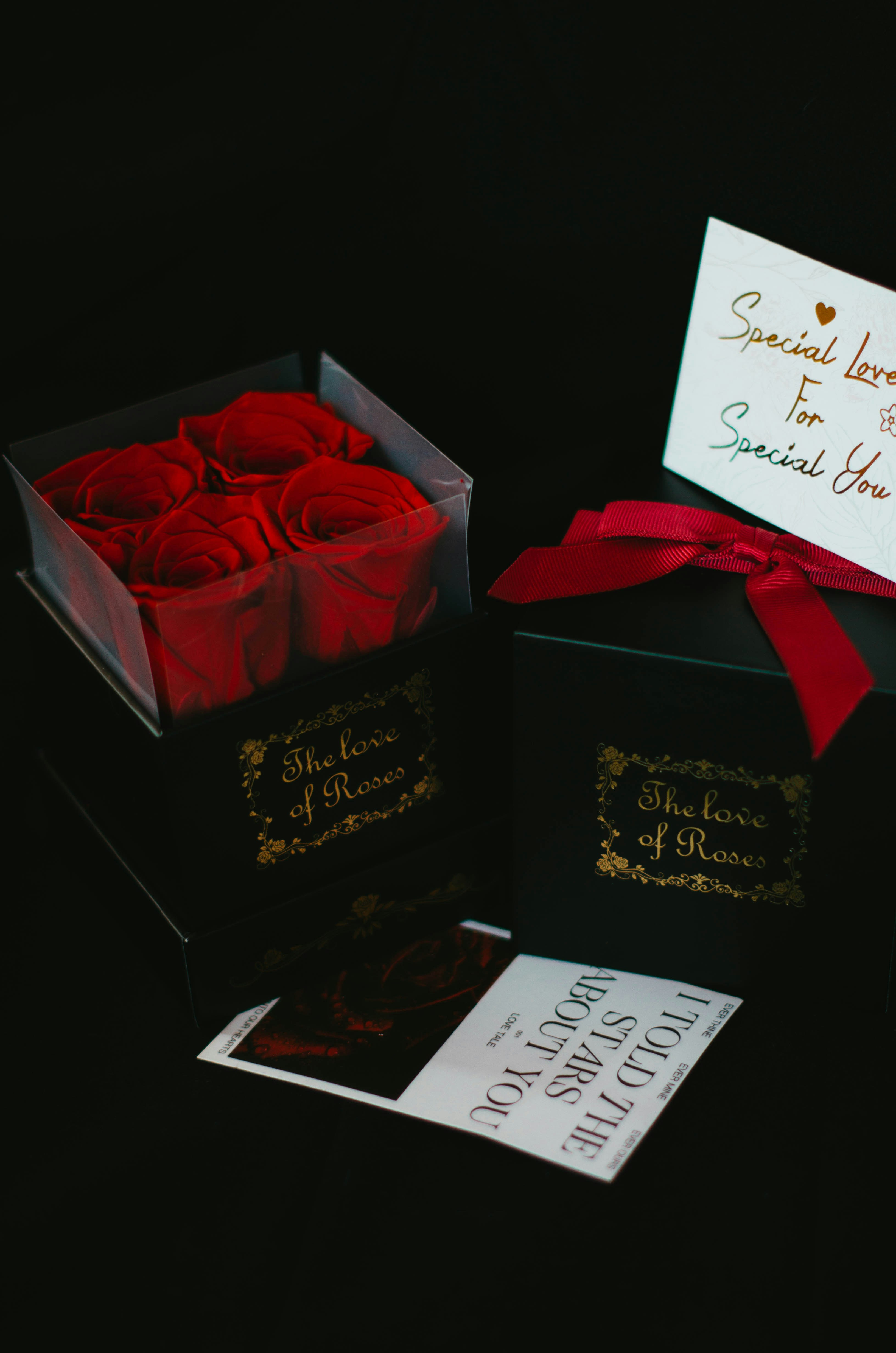 a black box with a red rose in it