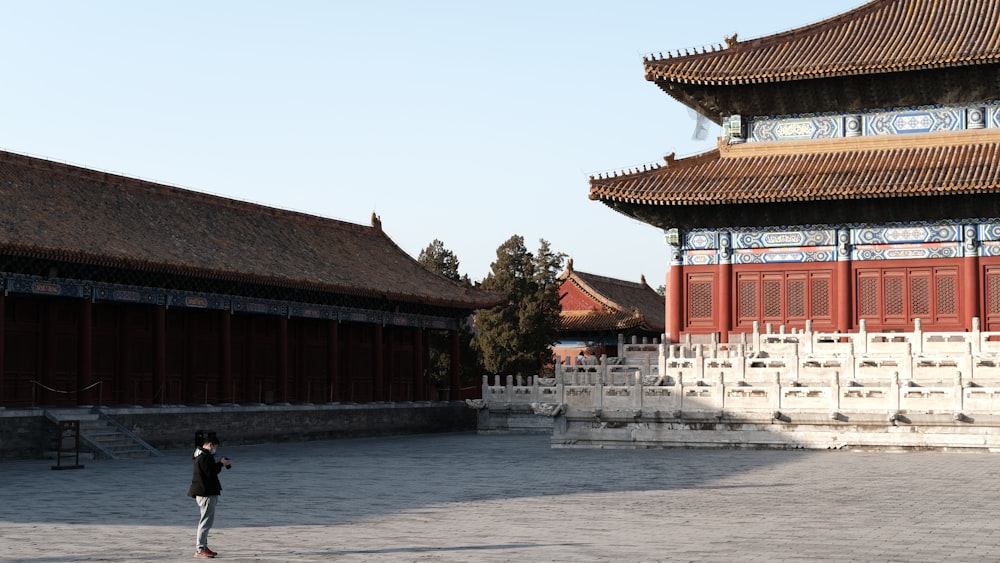 a person standing in front of a building