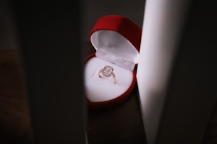 Close-up of sparkling diamond rings nestled in a velvet jewelry box.