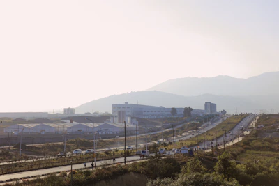 Wide shot of the Safira Vault warehouse exterior in Al Quoz Industrial 1 under clear skies.