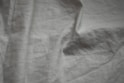 a black and white photo of a white sheet