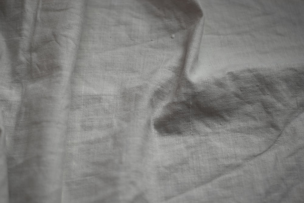 a black and white photo of a white sheet