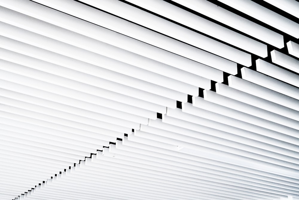 a long line of white lines on a ceiling