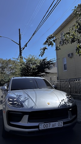 A clean, shiny car parked outside a cozy home, ready for a gig worker to start their day.