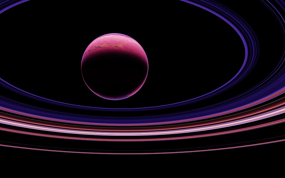 a black background with pink and purple circles