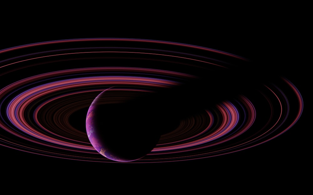 a black background with a purple and red swirl