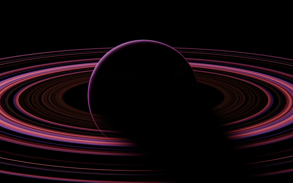 a black background with a purple and red circle