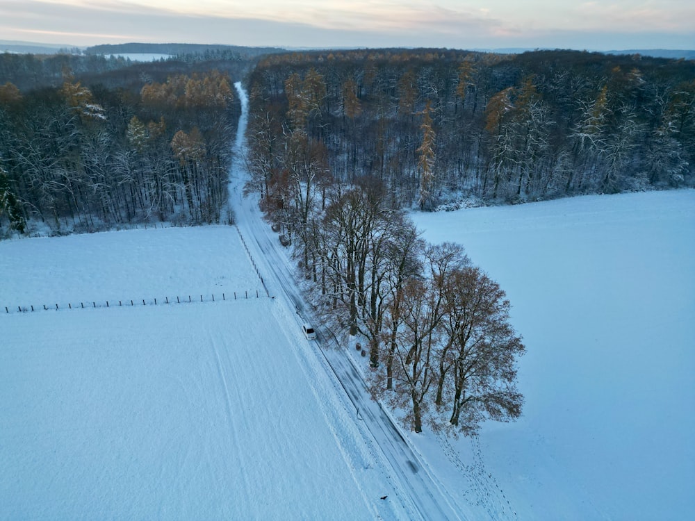 an aerial view of a snow covered field