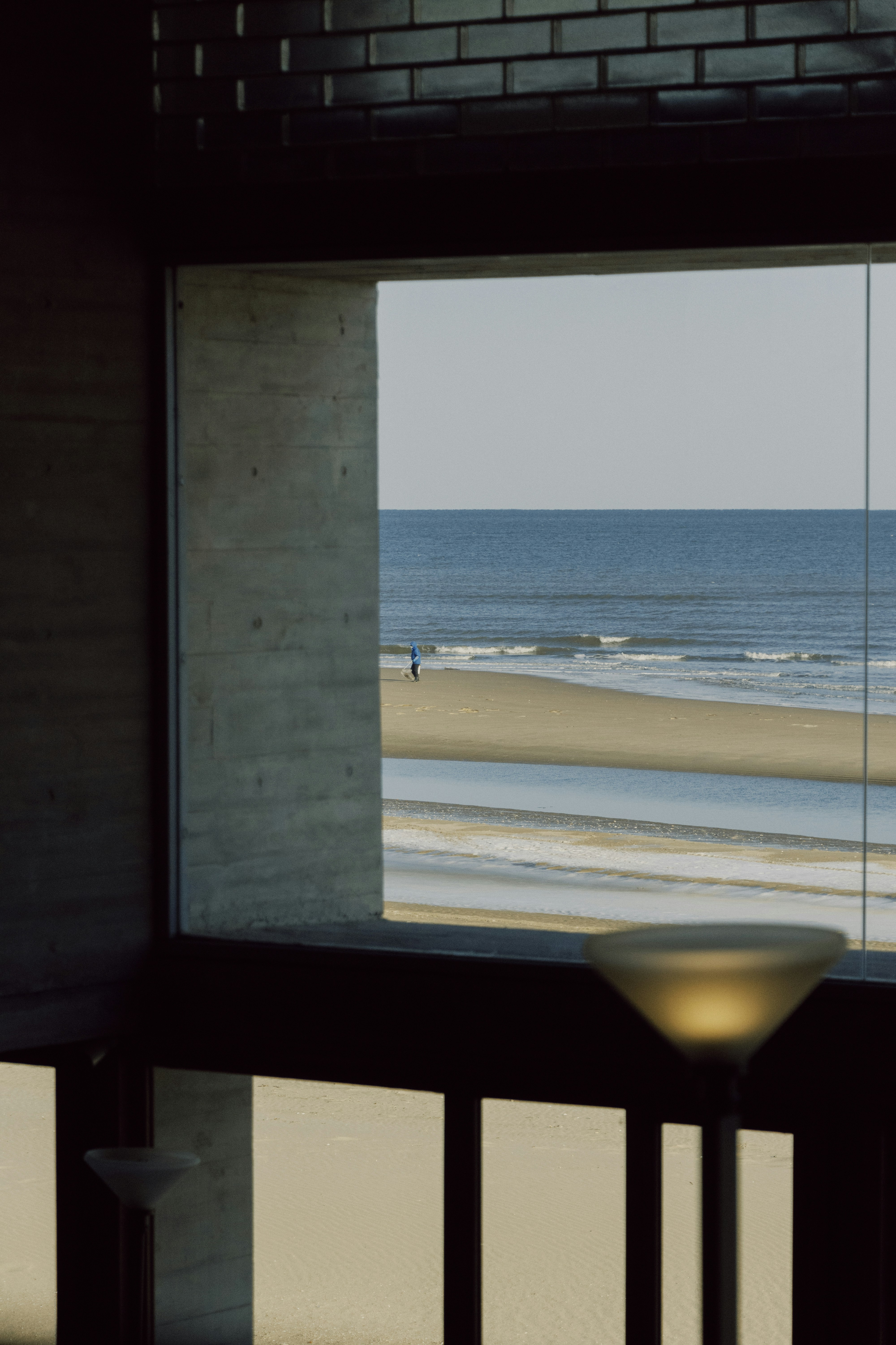 a view of a beach from a window