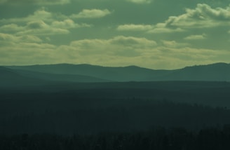 A cinematic scene of a fantasy landscape with subtle musical notes floating in the air.