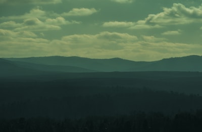 A cinematic scene of a fantasy landscape with subtle musical notes floating in the air.