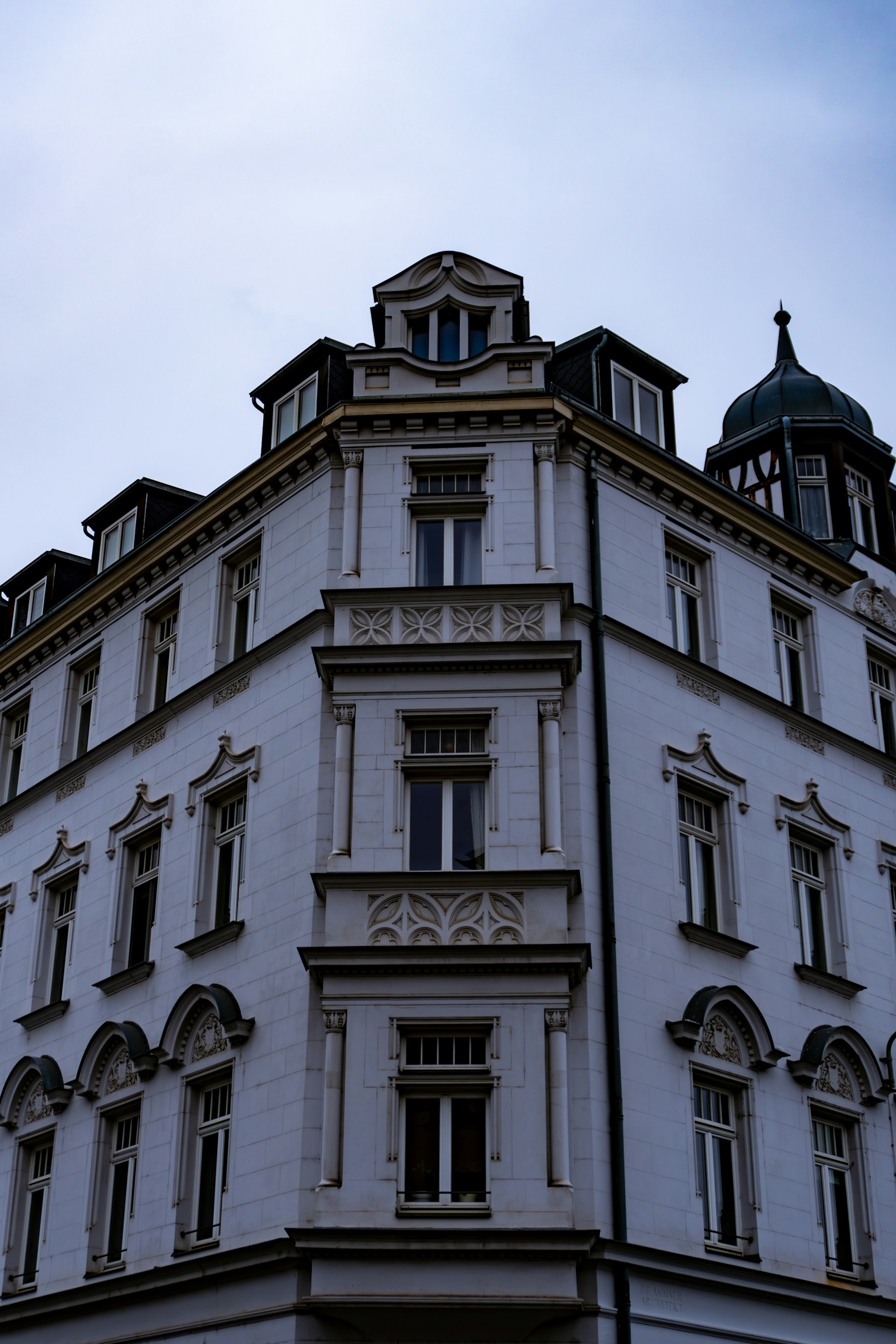 a tall building with a clock on the top of it