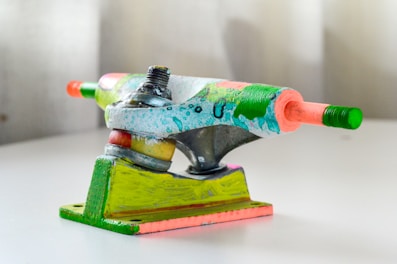 Skateboard trucks mounted on a deck, ready for action.