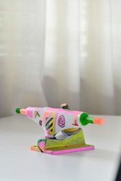 A set of professional skateboarding trucks laid out neatly on a wooden table.