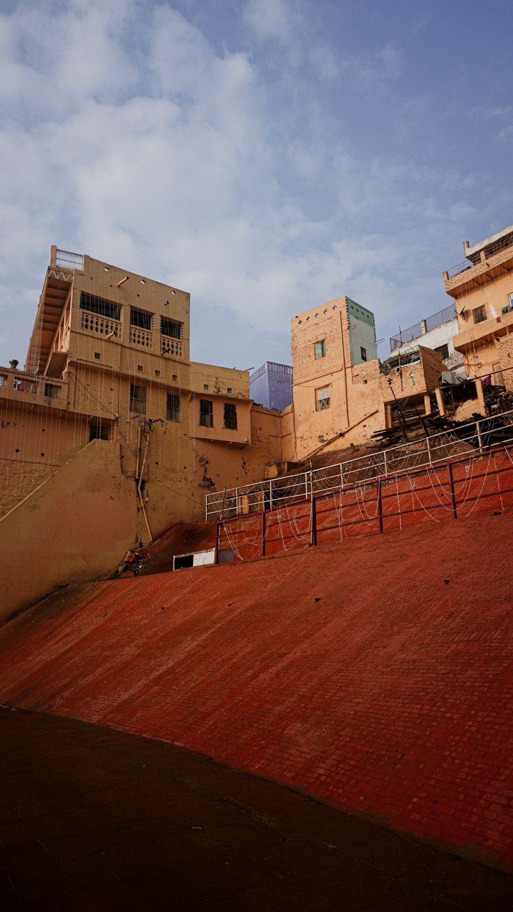 a view of some buildings and a ramp