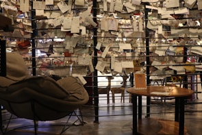 A cozy corner with comfortable seating and recycled materials, perfect for brainstorming.