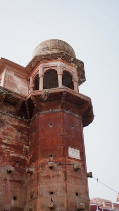 a tall tower with a clock on the top of it