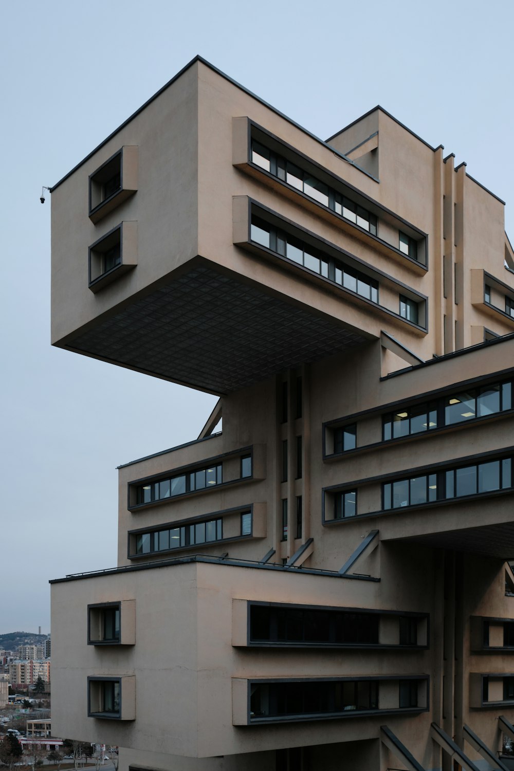 a tall building with many windows on top of it