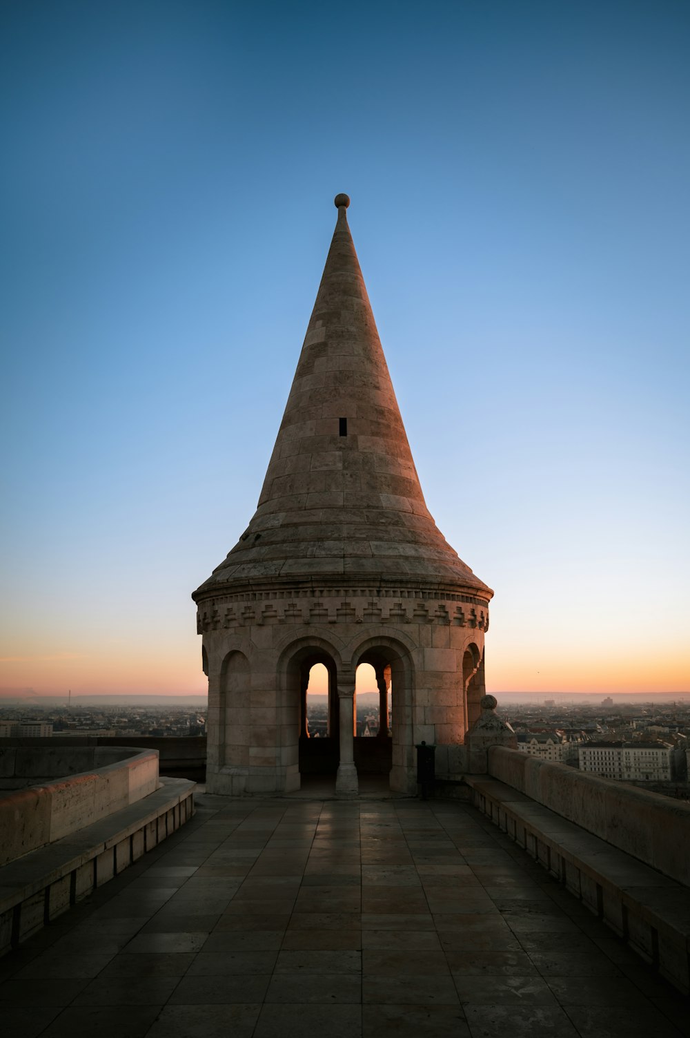 a very tall tower with a clock on it's side