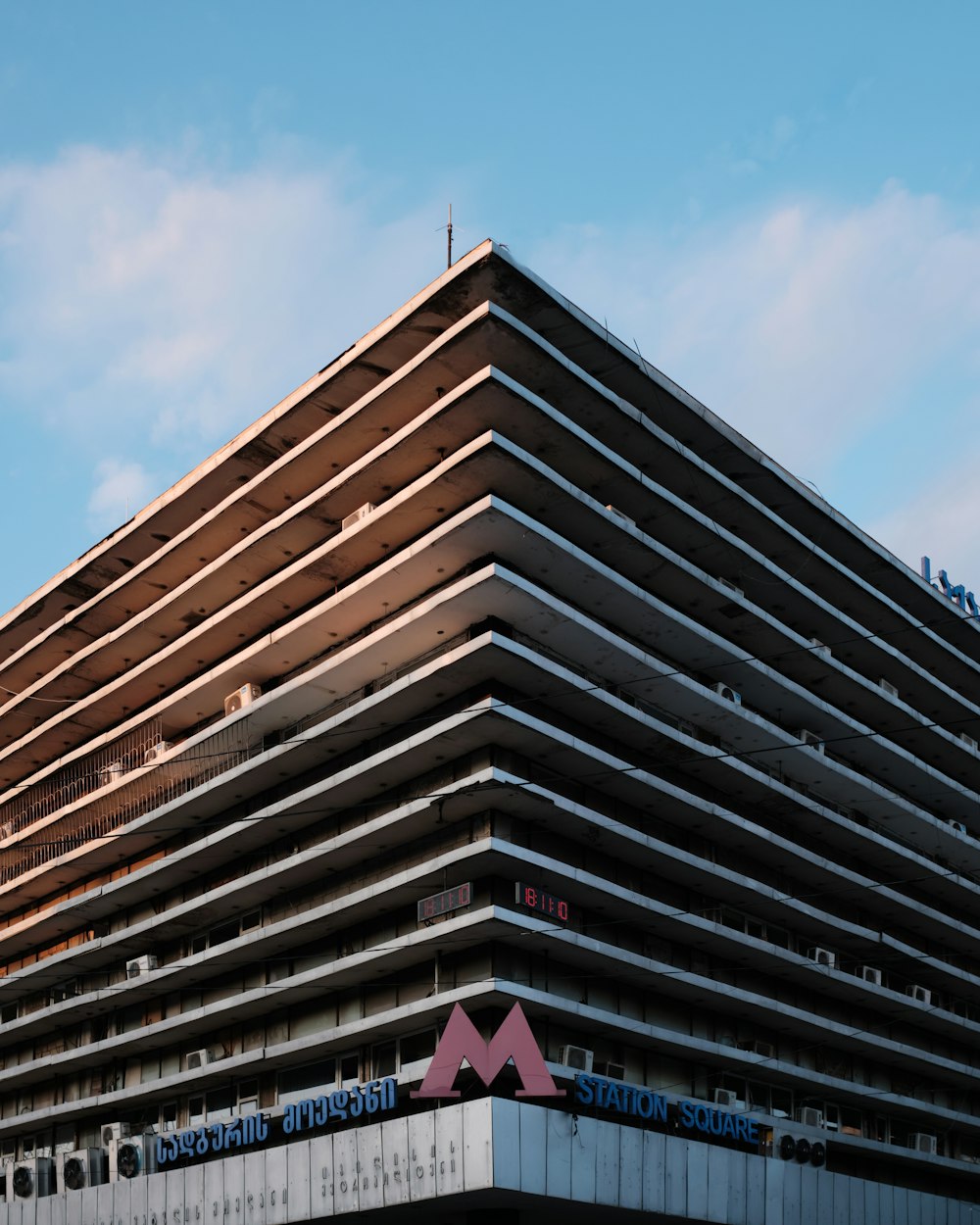 a very tall building with a sky background